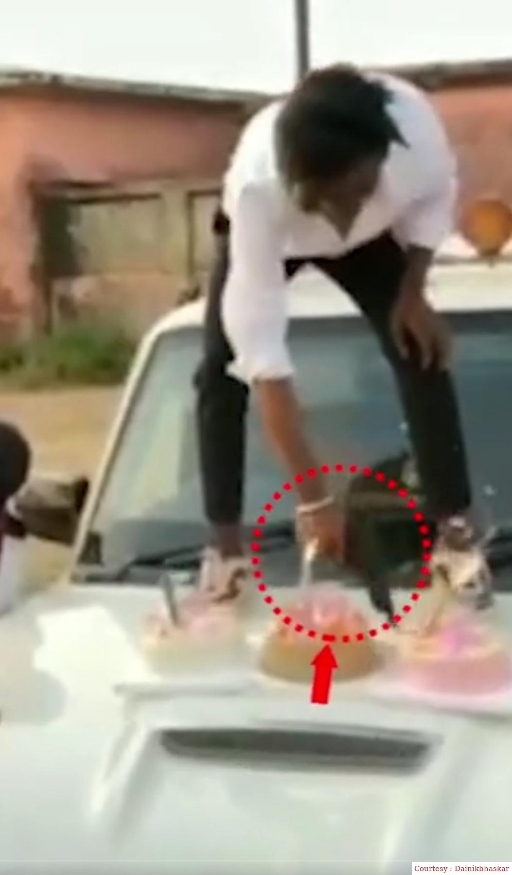 Birthday cake cut from a pistol on the bonnet of the car: Gun kept waving a young man with friends on music.