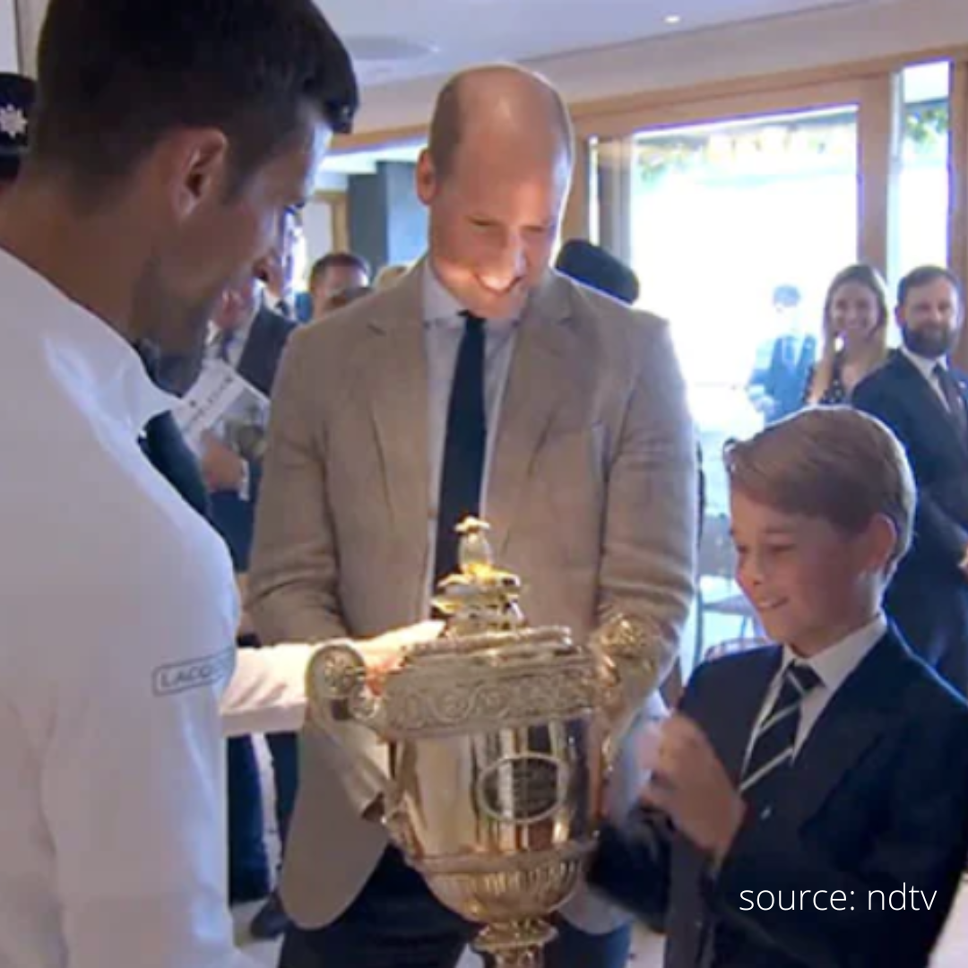 Prince George holds Novak Djokovic’s Wimbledon Trophy
