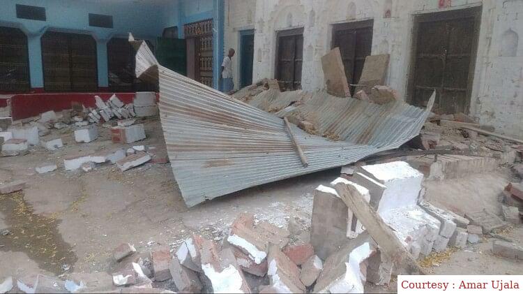 Two people died due to falling wall under construction.